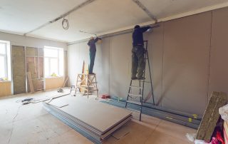 Workers-Are-Installing-Plaster Workers are installing plaster